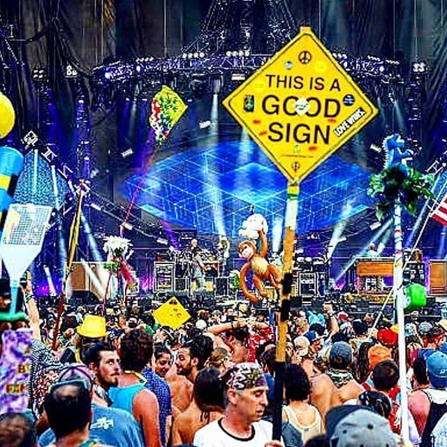 A Good Sign held above a crowd at a live music event