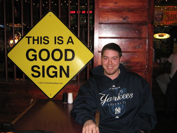 Jesse beside the first large printed Good Sign